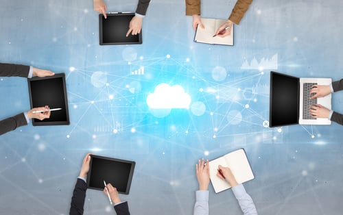 Group of people with devices in hands working on reports with online teamwork and cloud technology concept-1